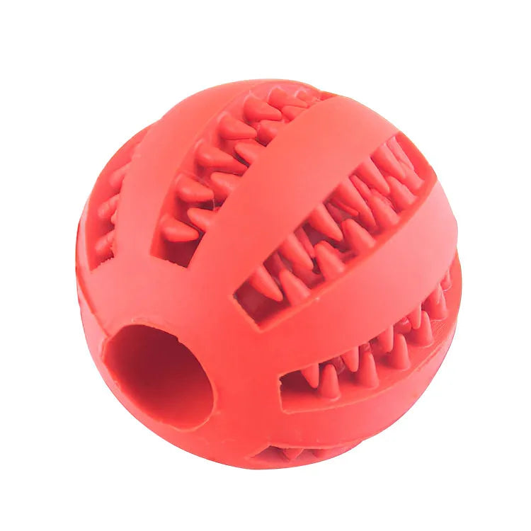 Red rubber dog toy ball with textured surface on a white background