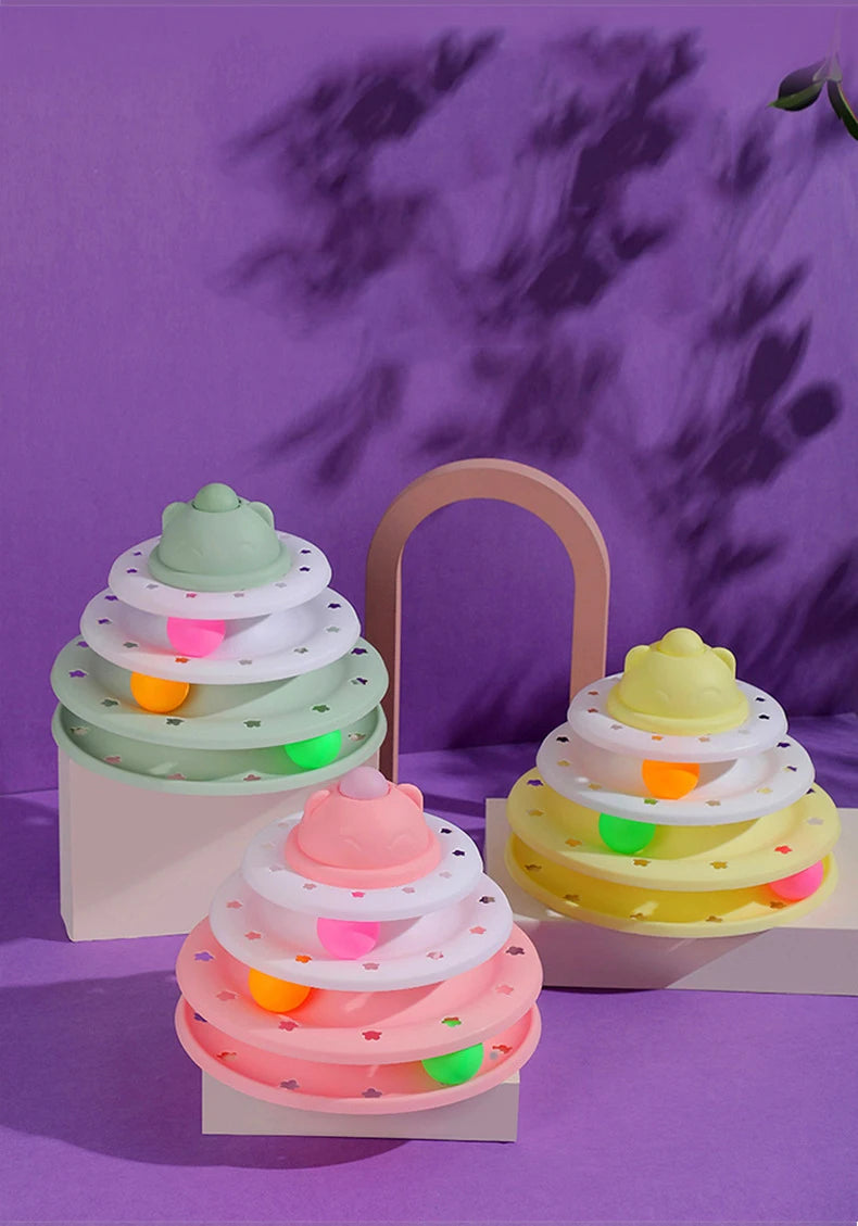 Set of colorful tiered toys on a purple background
