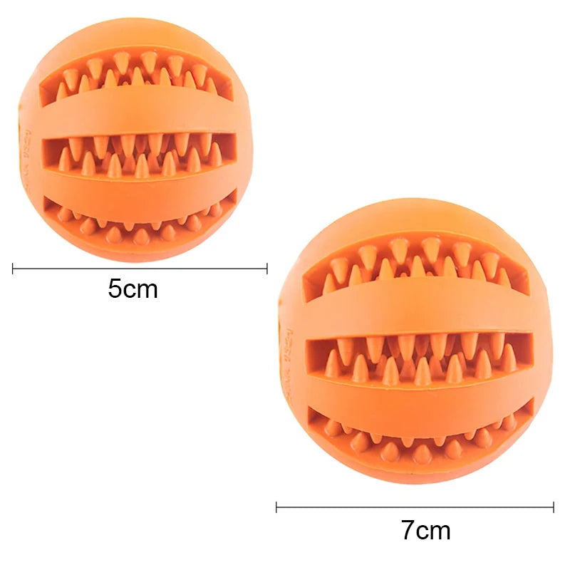 Two orange rubber balls with grooves and measurements on a white background