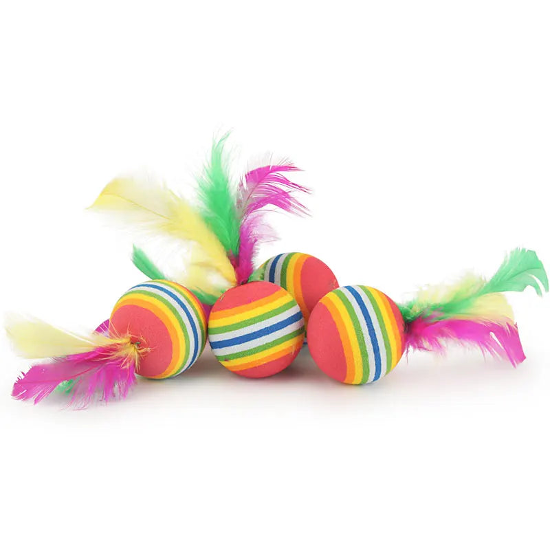 Colorful striped cat toy with feathers on a white background