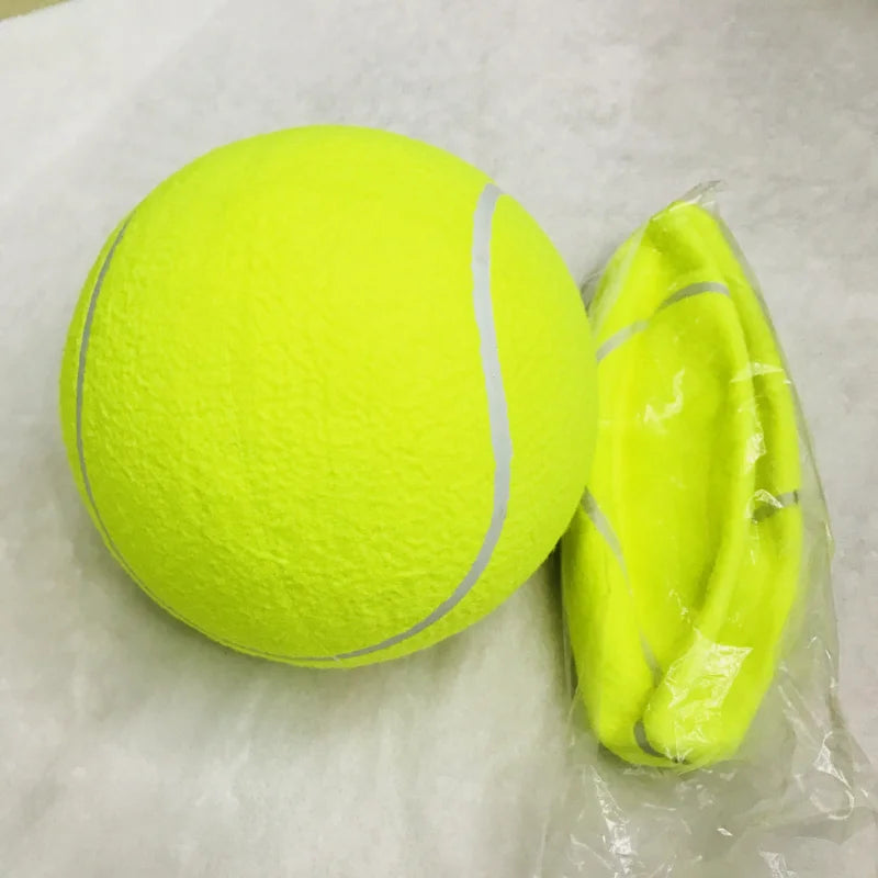 Yellow tennis ball with a white stripe next to a deflated one on a white background