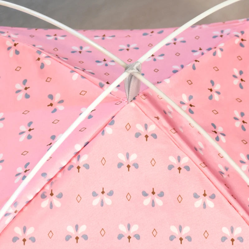 Close-up of a pink tent with floral pattern
