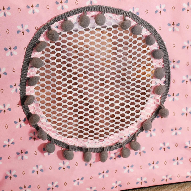 Round pink mat with gray mesh center and pom-pom trim on a pink floral background