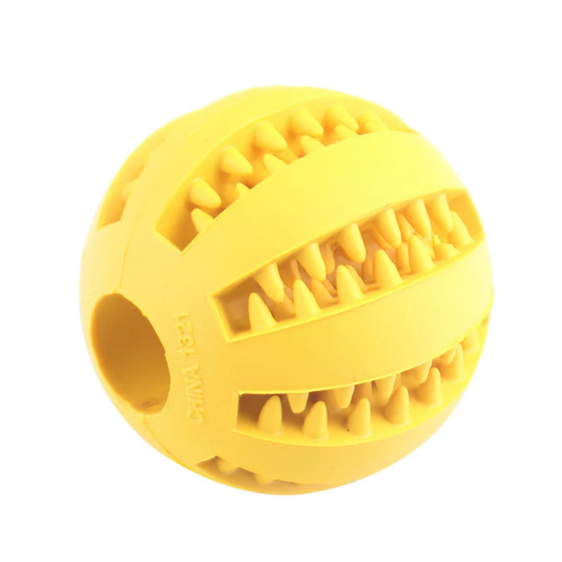 Yellow rubber dog toy ball with textured surface on a white background