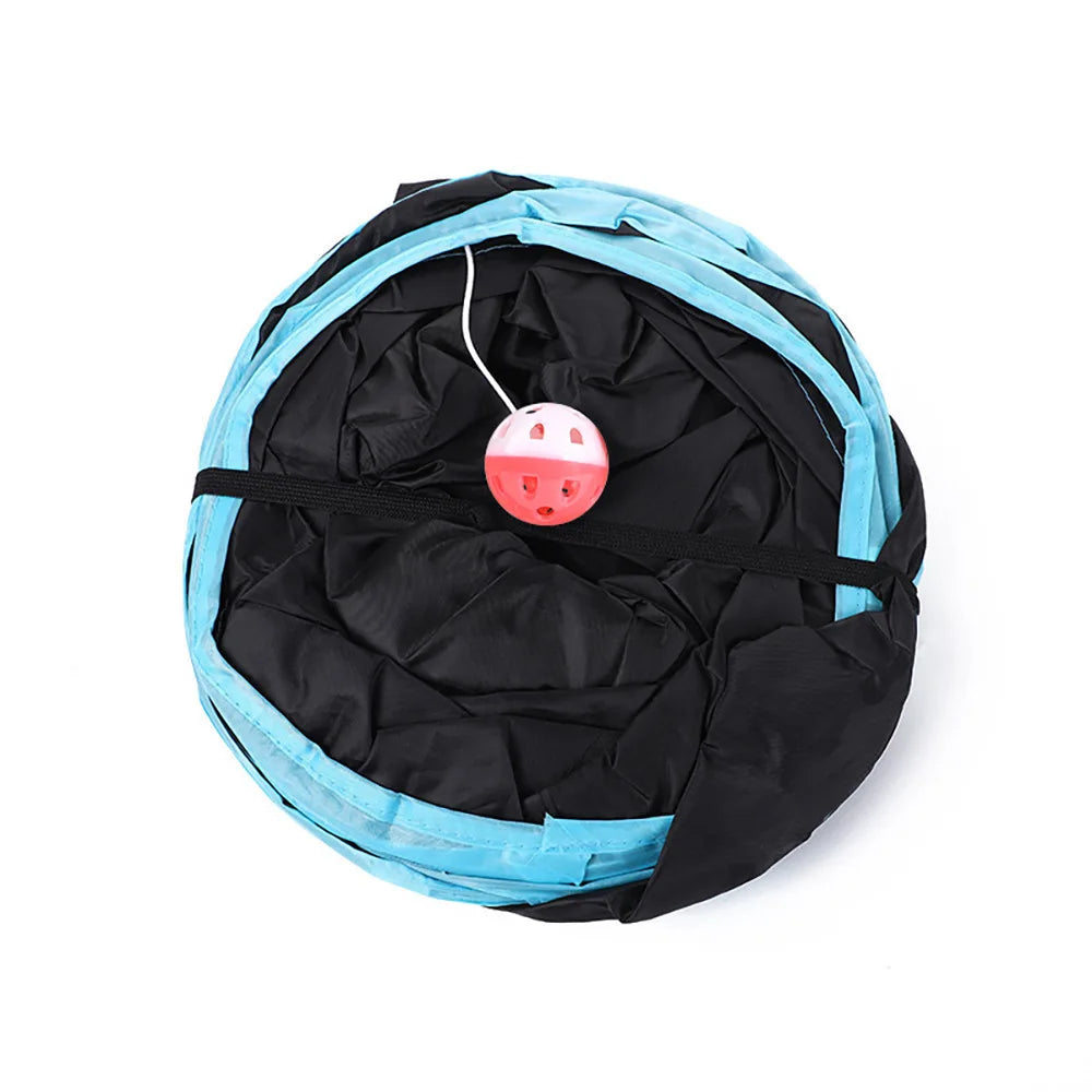 Black and blue pet toy with a pink and white ball inside on a white background
