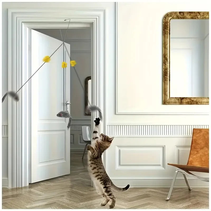 Cat playing with a hanging toy in a modern interior setting