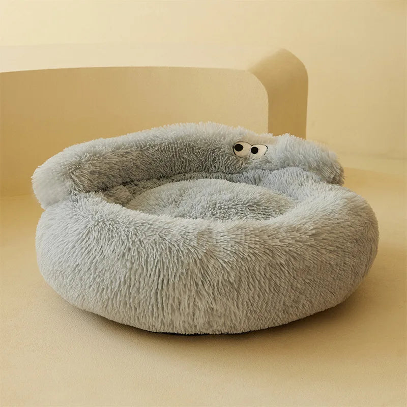 Fluffy gray pet bed on a beige background