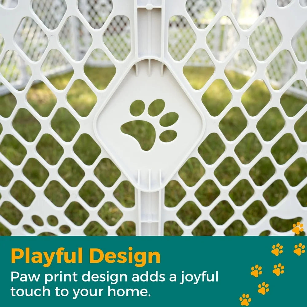White pet gate with green paw print design against a grass background