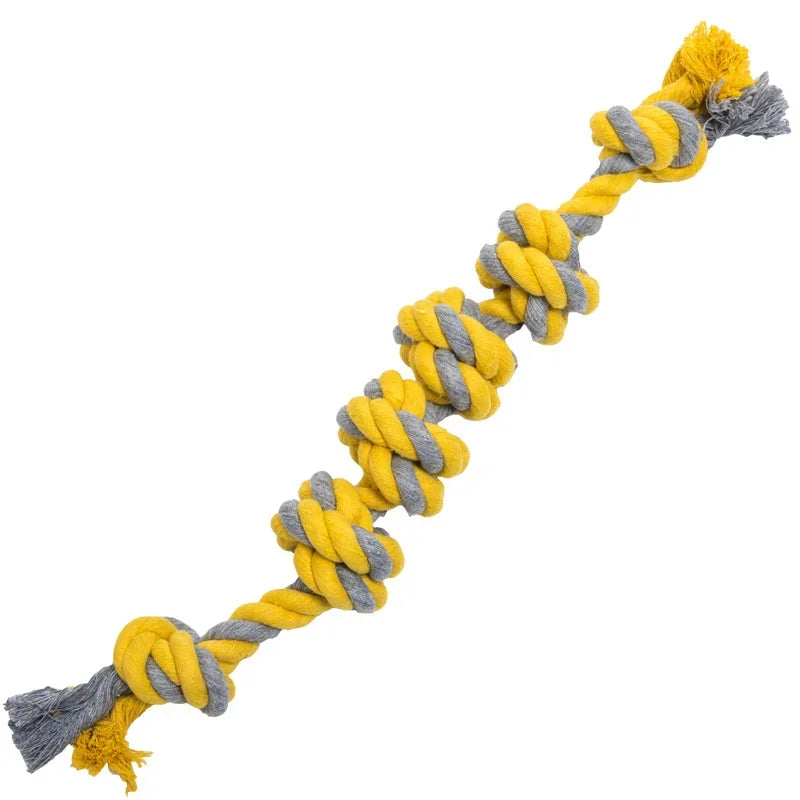 Yellow and gray braided rope toy on a white background