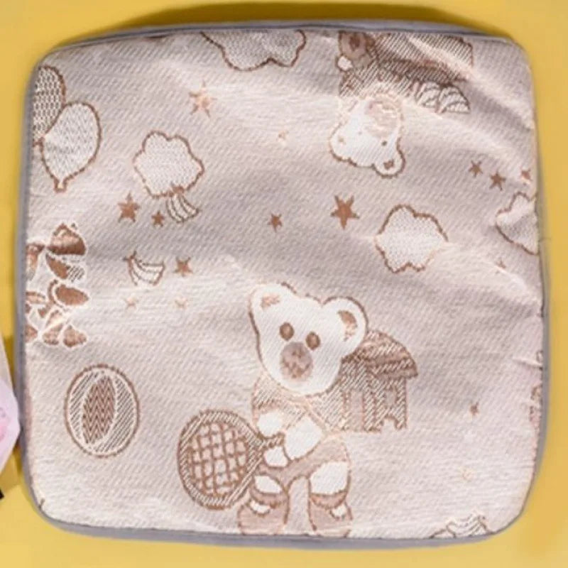 Cat pillow with teddy bear design on a yellow background