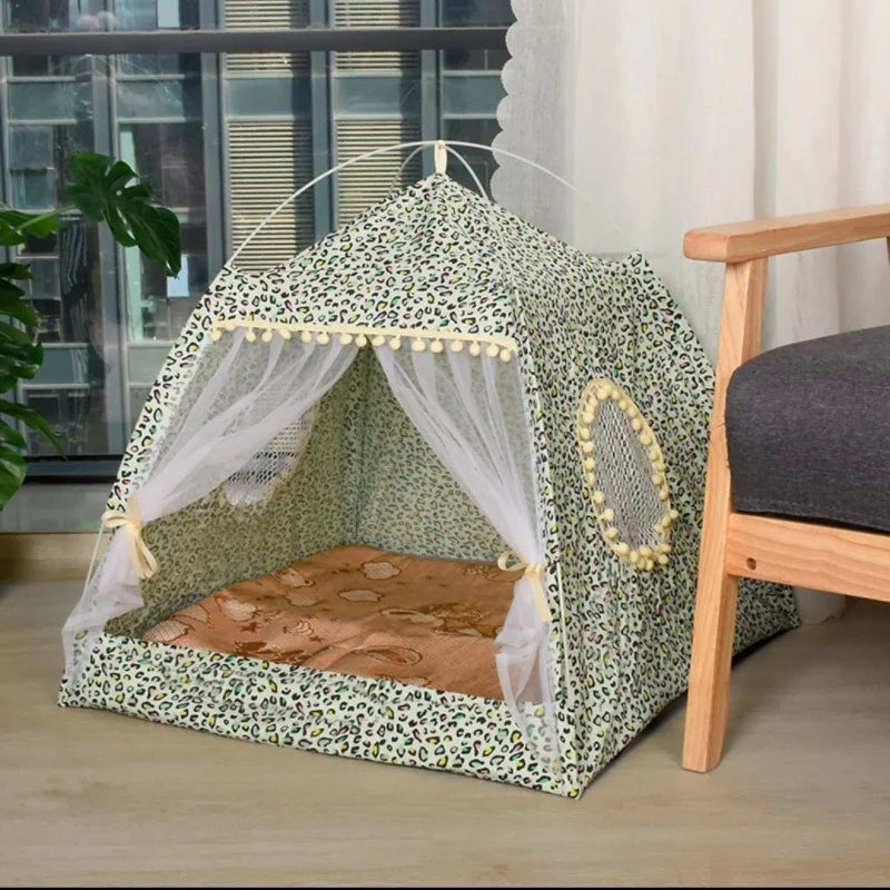 Pet playpen with leopard print design on a wooden floor.