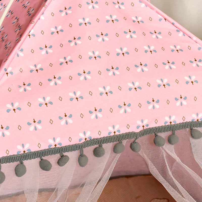 Pink cat tent with floral pattern and gray pom-pom trim