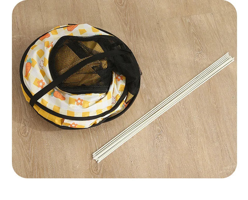 Folded pet tent woth metal rods for tent stance ready to travel.