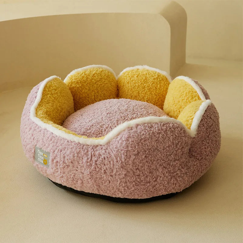 Fluffy pink and yellow pet bed on a beige background