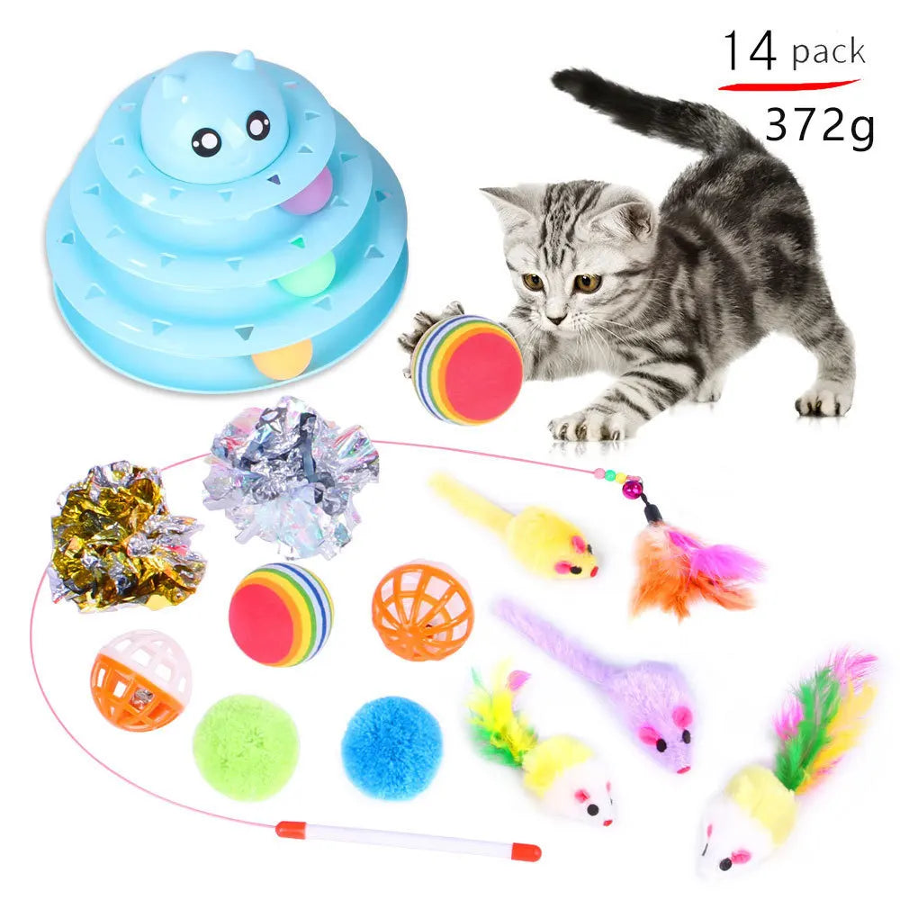 Cat toys set with a cat playing, including a blue 3 tiered ball slot toy and various other toys.