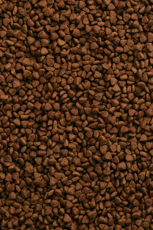 a close up of a pile of brown rocks