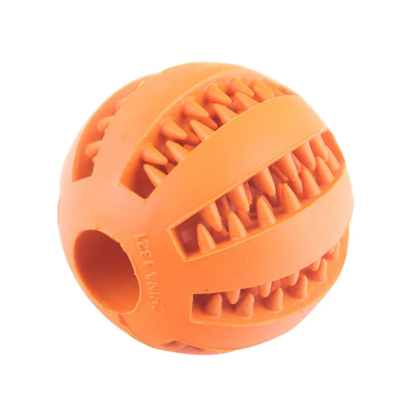 Orange rubber dog toy ball with textured surface on a white background