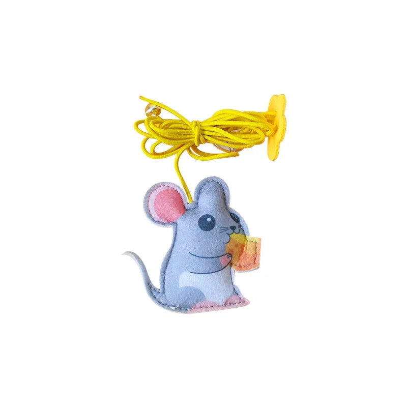 Plush toy mouse with a yellow string on a white background