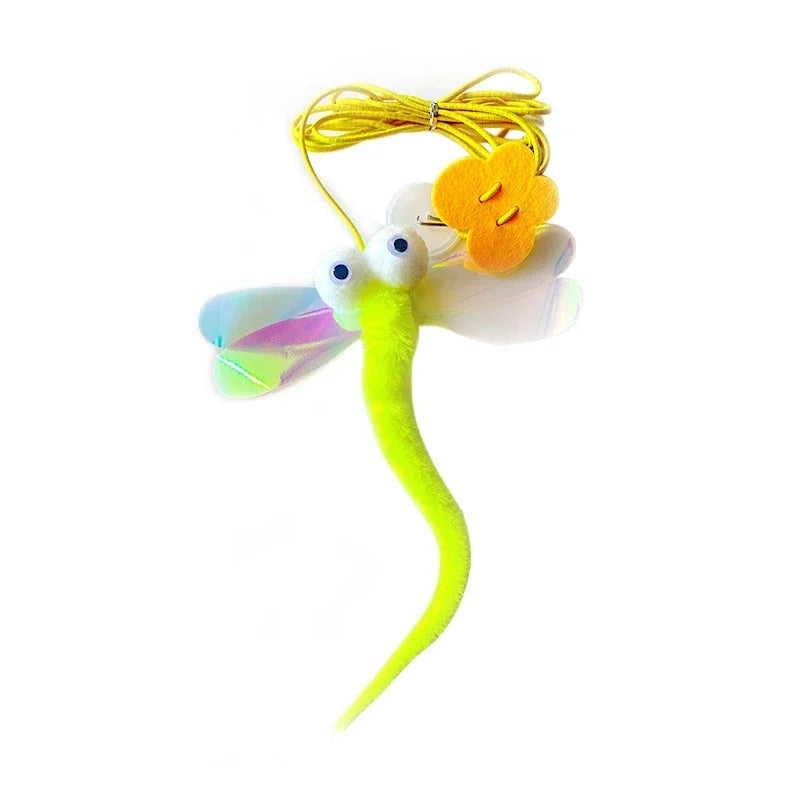 Toy dragon fly with a yellow cord on a white background