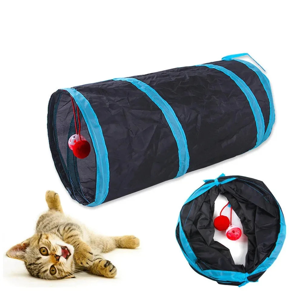Black and blue cat tunnel toy with red balls, shown with a cat playing with it.
