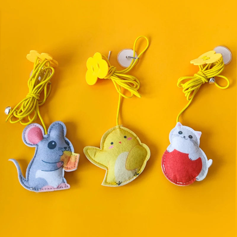 Three colorful animal-shaped clips on a yellow background